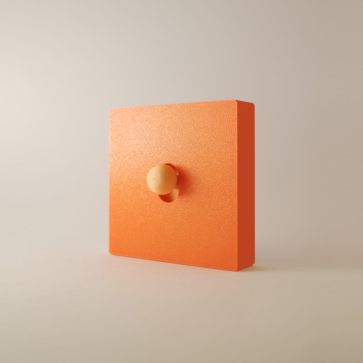 Cache interrupteur Fox monobloc orange vif, façade et cadre en une seule pièce, bouton orange abricot